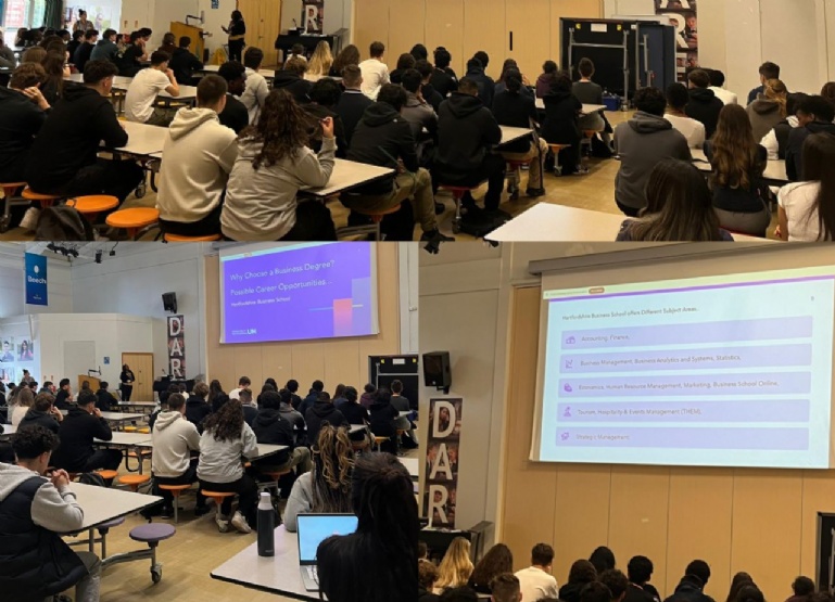 students in main hall listening to a presentation
